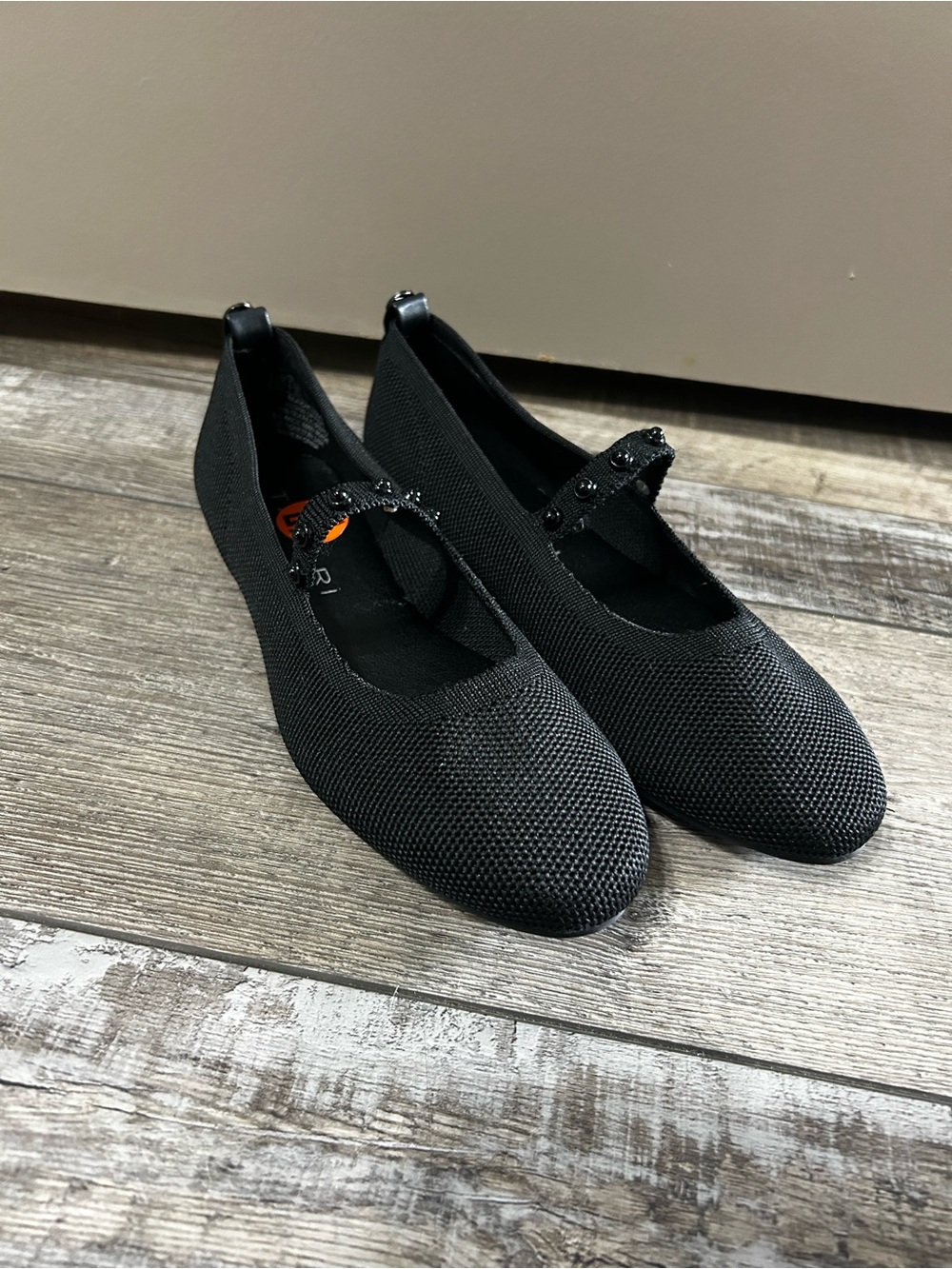 black Tahari Madeira Mary-Jane flats featuring a breathable knit beaded strap
